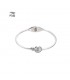 Zilverkleurige spang armband met cirkel en een steentje