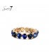 Goudkleurige armband met blauwe glas steentjes