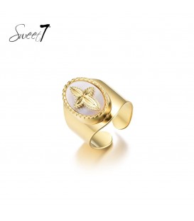 Goudkleurige ring met schelp en kruis
