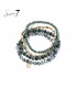 Smaragd groene armband met glas kralen en goudkleurige accenten
