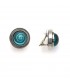 Oorclips met turquoise spiraal en bol glasdesign en een zilverkleurige rand