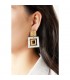 Oorclips met vierkante vormen in goud en zilverkleur