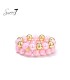Armband set met roze kralen en goudkleurige details