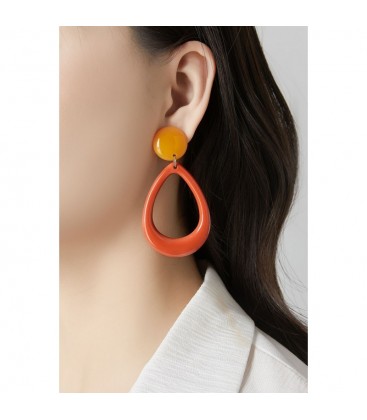 Oorclips oranje ovale hanger met een ronde gele oorknop.